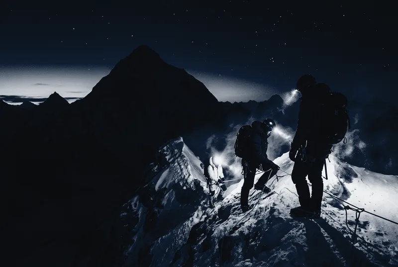 Night push above Camp 4, headlamps on the fixed line